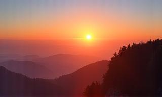 Sunrise view from a mountain peak during a hike